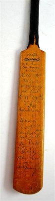 Lot 137 - A small cricket bat with England team signatures