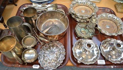 Lot 153 - A quantity of plated ware including three coasters, chamber candlesticks, mugs, flatware etc