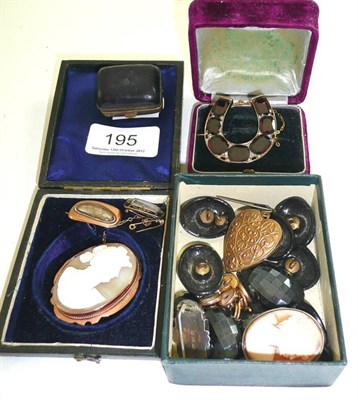 Lot 195 - A Victorian flat cut garnet set horseshoe brooch, two shell cameo brooches, two Georgian...