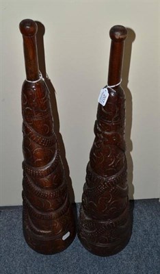 Lot 207 - A pair of mid-20th century Iranian carved wood ";Zul-Khane"; swinging clubs, each of skittle shape