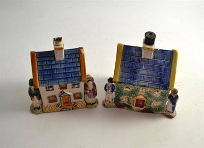 Lot 230 - Two Staffordshire pottery house money boxes