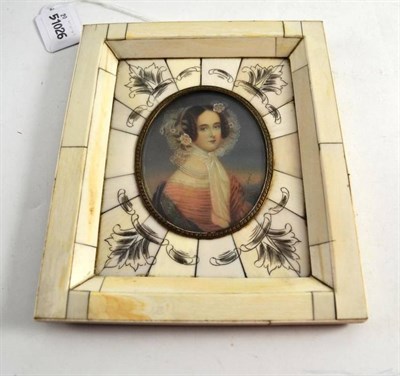 Lot 240 - A miniature of a lady wearing pearls, lace bonnet and peach dress signed Dupre, in ivory frame