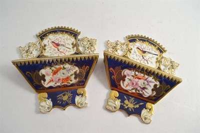 Lot 242 - A pair of porcelain wall pockets