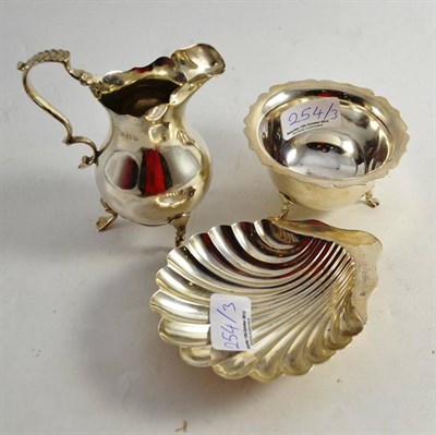 Lot 254 - Silver cream jug, sugar basin and shell butter dish