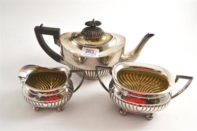 Lot 263 - A matched silver three piece tea service, various marks