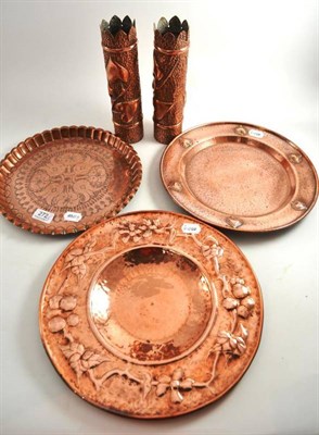 Lot 272 - A WMF copper charger, two similar small chargers and a pair of Arts and Crafts copper beaker vases