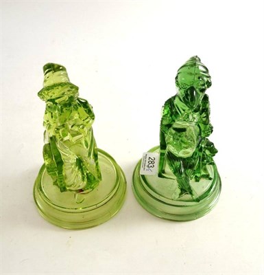 Lot 283 - Two John Derbyshire Punch and Judy green glass figures