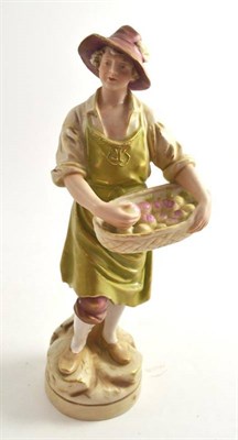 Lot 285 - A Royal Dux figure of a fruit vendor