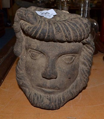 Lot 295 - A carved stone head