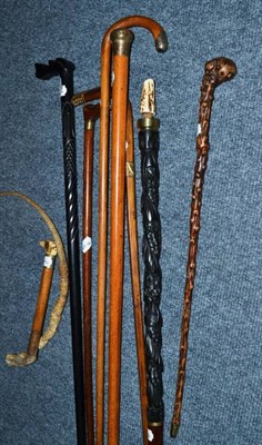 Lot 309 - Seven various walking sticks and a riding crop (8)