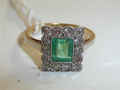 Lot 327 - An emerald and diamond cluster ring stamped 18CT and PLAT