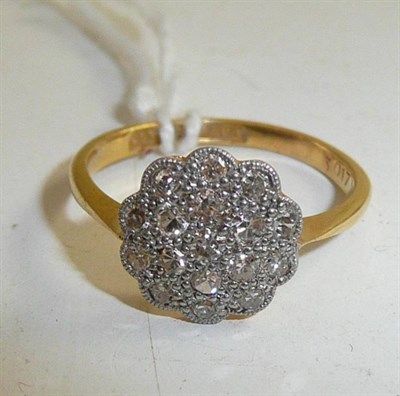 Lot 328 - A diamond cluster ring stamped 18CT and PT