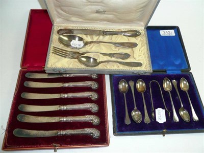 Lot 343 - A cased set of six silver teaspoons and sugar tongs, a cased set of six silver handled tea...