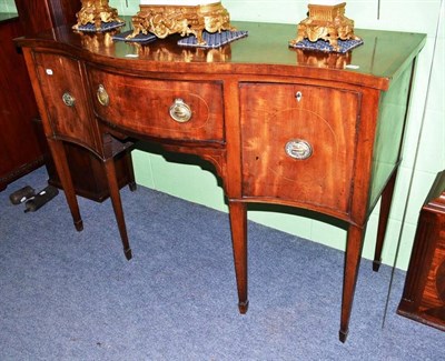 Lot 413 - A 19th century mahogany serpentine fronted sideboard