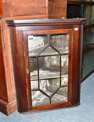 Lot 433 - A mahogany glazed corner cupboard