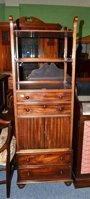 Lot 447 - A 19th century mahogany night stand with three open shelves, above two drawers, above cupboard...