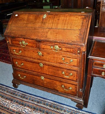 Lot 459 - A Georgian oak inlaid bureau