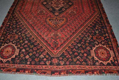 Lot 465 - Kashgai carpet South West Persia, The rose pink lozenge field framed by spandrels and narrow...