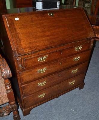 Lot 470 - George III oak bureau