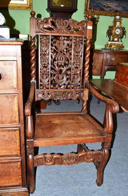 Lot 474 - Carved oak high back chair