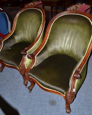 Lot 478 - A pair of Victorian carved mahogany elbow chairs with green velvet upholstery