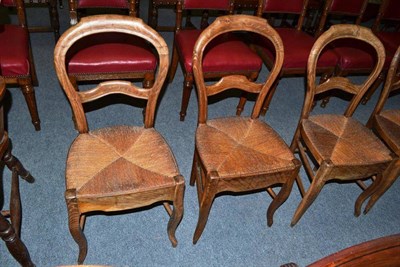 Lot 484 - Six walnut French Provincial rush seated dining chairs