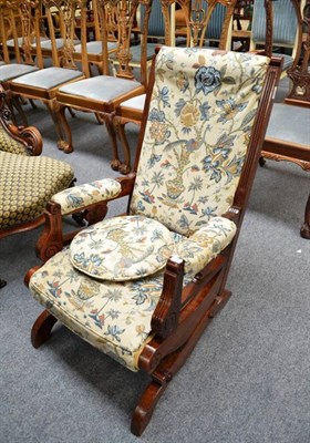 Lot 492 - A late 19th century walnut rocking chair