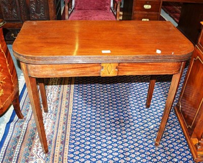 Lot 507 - A Regency fold over tea table