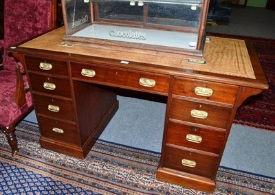 Lot 509 - An early 20th century mahogany pedestal desk with drop flap and leather top