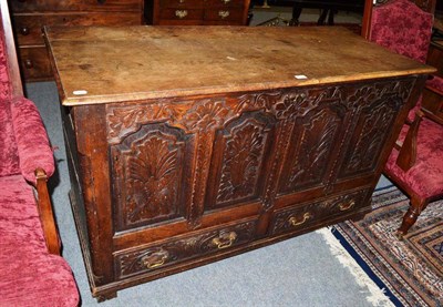 Lot 512 - An 18th century carved oak dower chest