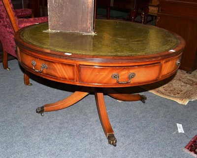 Lot 513 - A reproduction drum coffee table