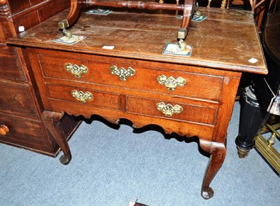 Lot 520 - An 18th century oak lowboy