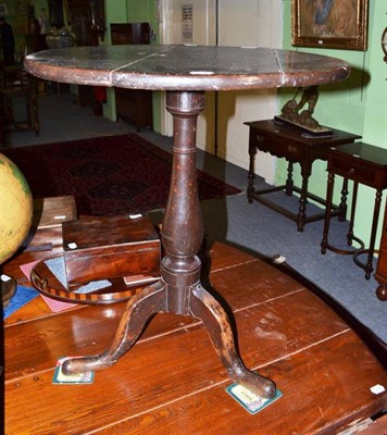 Lot 528 - A 19th century oak tripod occasional table