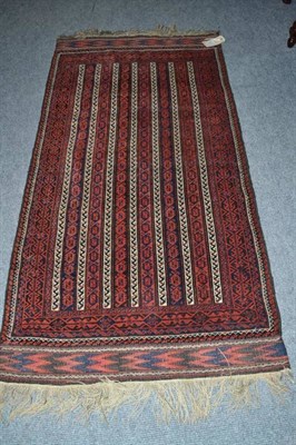 Lot 529 - Balouch rug Khorasan, the field with columns of boteh enclosed by narrow borders,141 by 73 cm