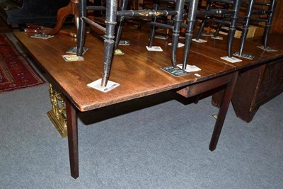 Lot 534 - A 19th century mahogany drop leaf table