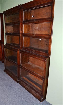 Lot 546 - A pair of oak stacking book cases