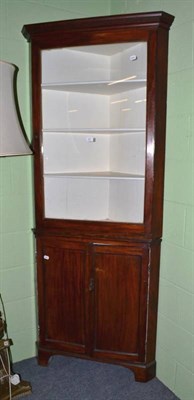 Lot 547 - A mahogany glazed floor standing corner cupboard