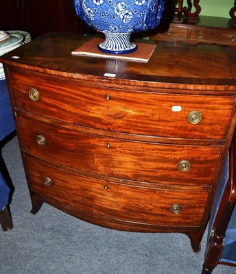 Lot 561 - A 19th century bow fronted three height chest of drawers