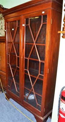 Lot 564 - Early 20th century glazed bookcase