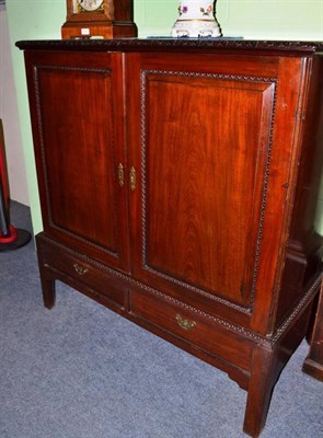 Lot 568 - Mahogany two door cabinet