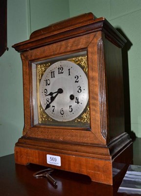 Lot 569 - A walnut cased mantel clock