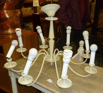 Lot 632 - Large modern table lamp with shade, cream eight arm chandelier and a standard lamp and shade (3)