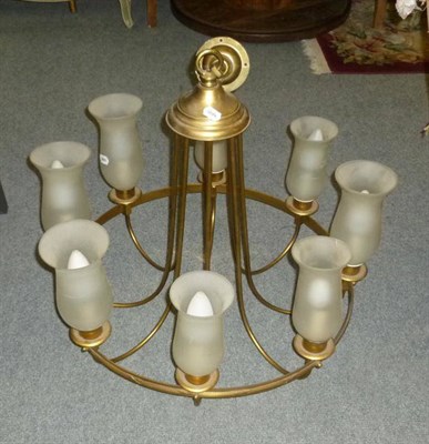 Lot 655 - A brass eight branch chandelier