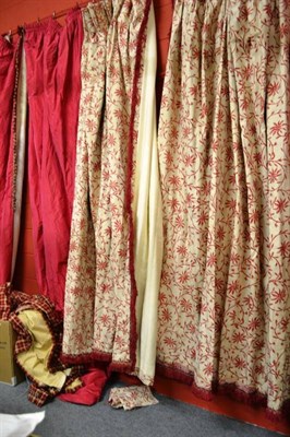 Lot 676 - A pair of pomegranate silk curtains, red and cream floral curtains, and a pair of red check...