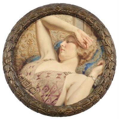 Lot 694 - Fortunino Matania RI (1881-1963) Italian A head and shoulders portrait of a lady in repose with her