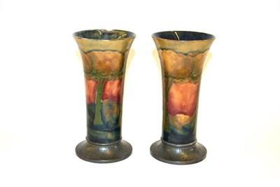 Lot 696 - A Pair of William Moorcroft Eventide Landscape Pattern Trumpet Vases, circa 1925, of flared trumpet