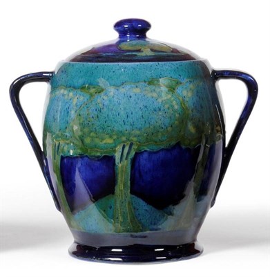 Lot 698 - A William Moorcroft Moonlit Blue Landscape Pattern Twin-Handled Jar and Cover, blue painted...