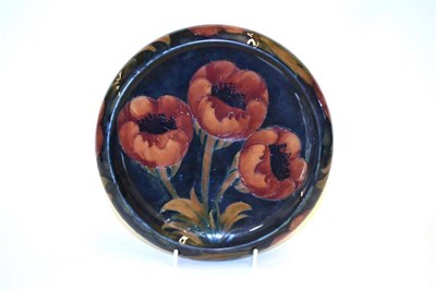 Lot 702 - A William Moorcroft Poppy Pattern Bowl, on a blue ground, impressed factory marks and blue...