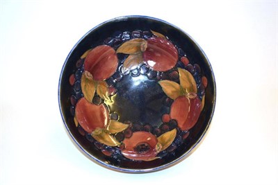 Lot 708 - A William Moorcroft Pomegranate Pattern Bowl, blue painted signature, impressed factory marks, 24cm