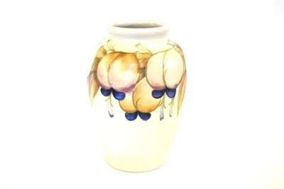 Lot 709 - A William Moorcroft Wisteria Pattern Vase, circa 1930's, on a pale matt ground, impressed...